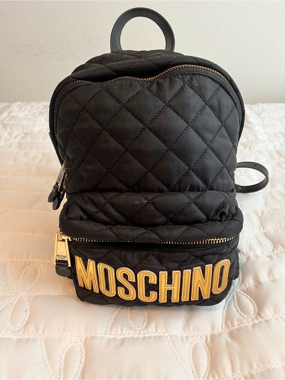 Moschino Black Quilted Mini Backpack with Gold Logo Patch